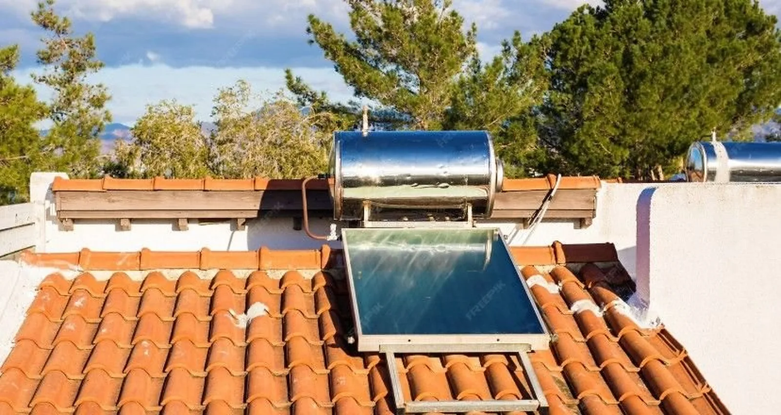 Flat-plate solar water heater on a tiled villa roof